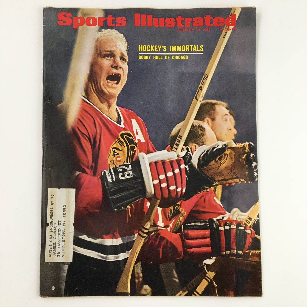 Cover of Sports Illustrated Magazine from February 12, 1968, featuring Hockey's Immortals and Bobby Hull of Chicago, depicting Hull passionately on the ice.