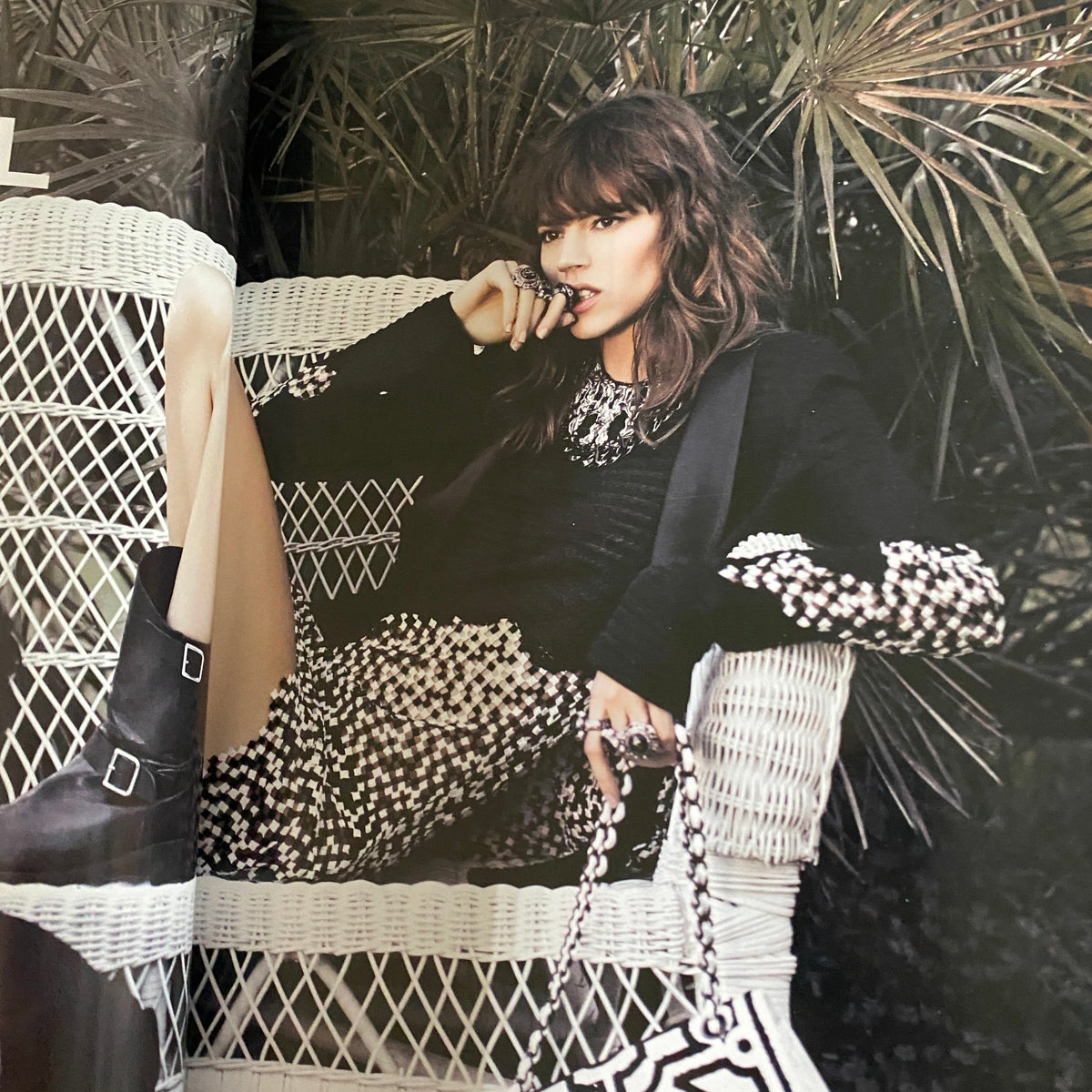 AnOther Magazine Spring/Summer 2011 Jennifer Lawrence Cover showcasing model in stylish outfit among lush greenery, highlighting early 2010s fashion trends.