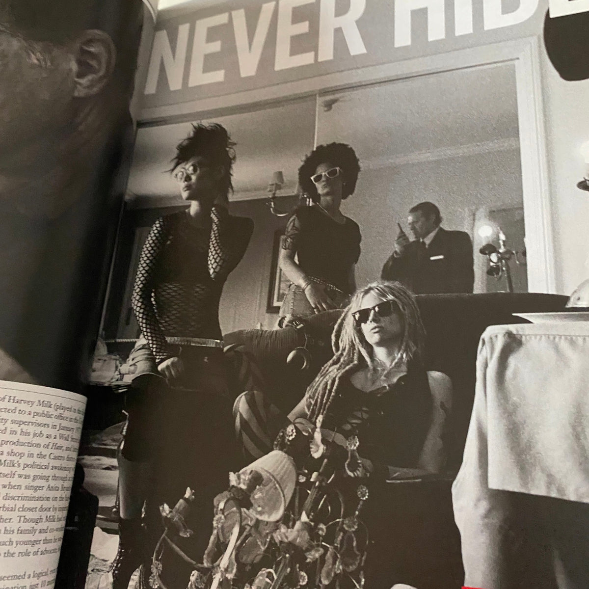 A dynamic black and white image capturing a group of stylish individuals in a fashionable setting, featured in the Interview Magazine January 2009 with Cate Blanchett on the cover.