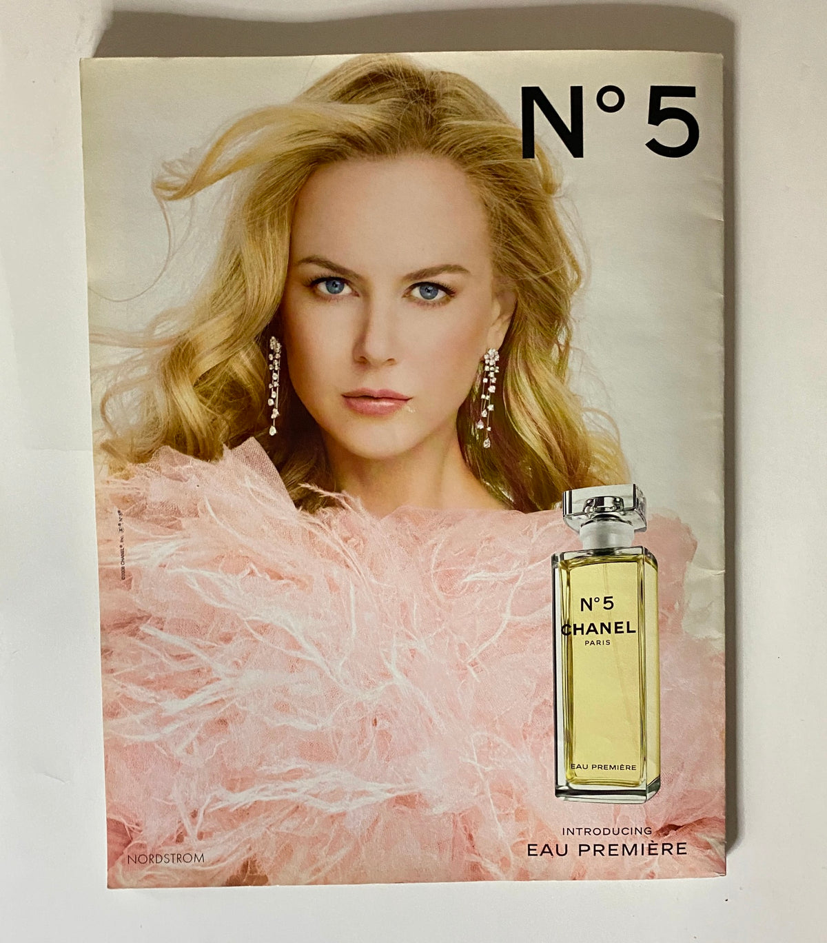 An elegant advertisement for Chanel N°5 premiere featuring a stunning model with golden hair and jewelry, highlighting a fragrance promotion within the Interview Magazine January 2009, which showcases Cate Blanchett on the cover.