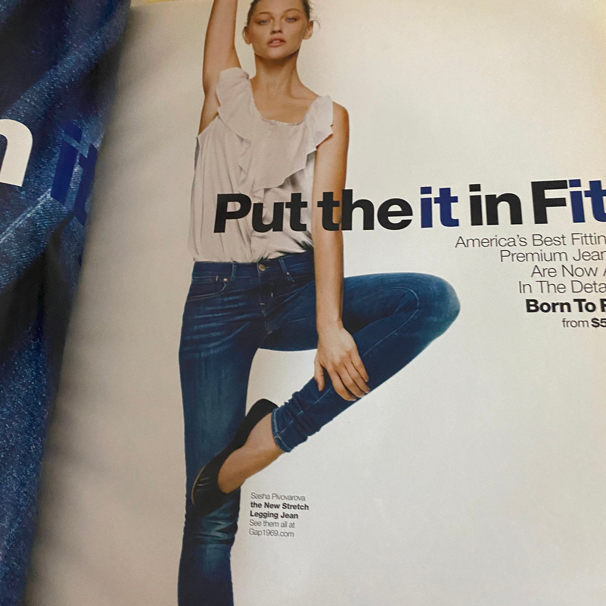 Inside page from Interview Magazine August 2010, featuring a model in stylish attire with the phrase 'Put the it in Fit' advertising premium jeans.