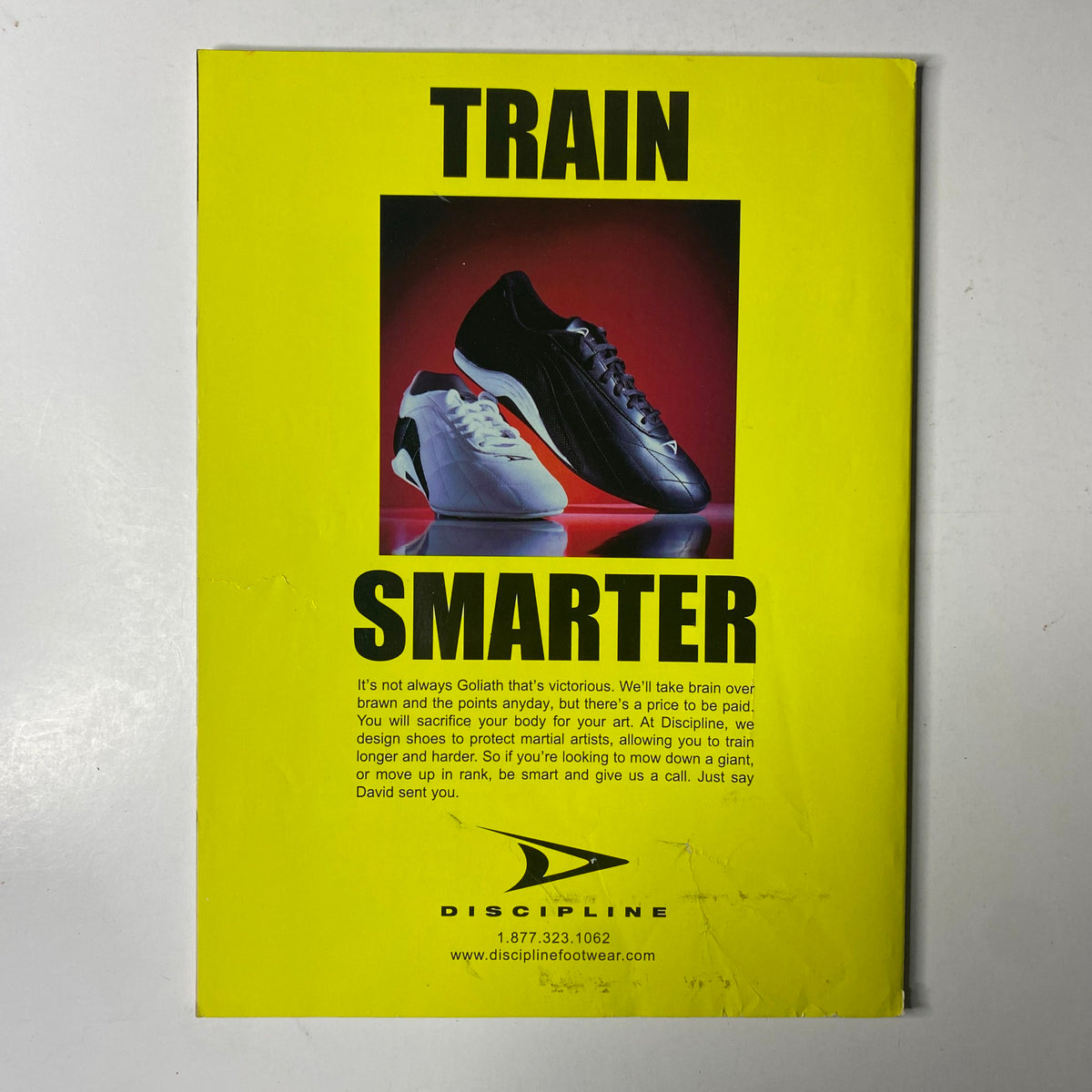 Advertisement for Discipline footwear, promoting training shoes for martial artists, featured in Inside Kung Fu Magazine February 2003.