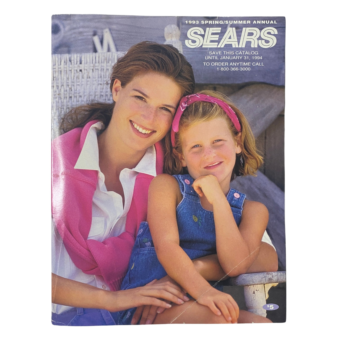 Cover of the 1993 Sears Spring/Summer Annual Catalog featuring a smiling woman and a young girl, highlighting early 90s fashion and lifestyle themes.