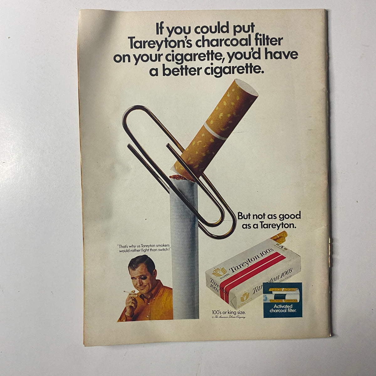 Advertisement on the back of Time Magazine January 10, 1969, promoting Tareyton's charcoal filter cigarettes, showcasing a cigarette with a paperclip.