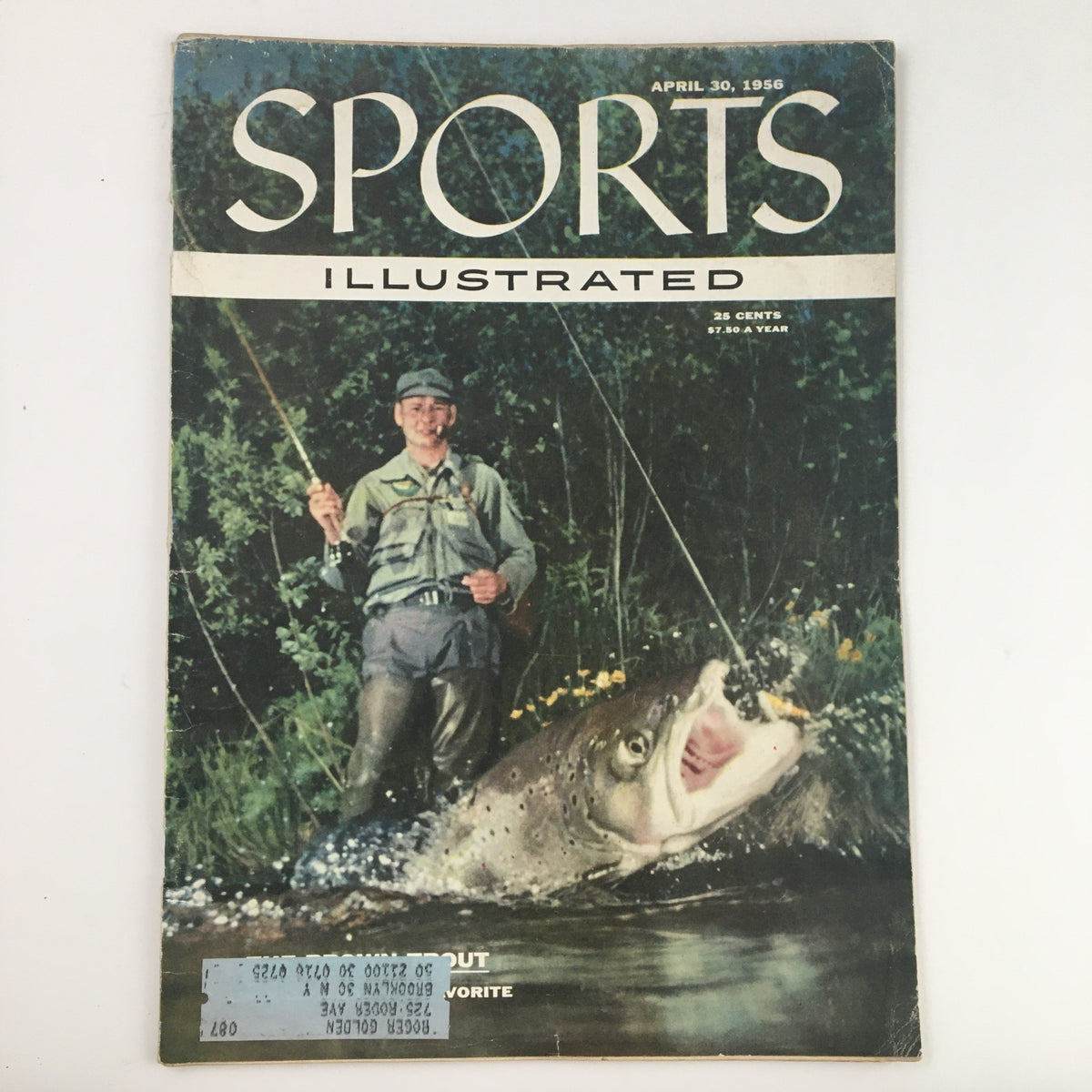 Cover of Sports Illustrated Magazine from April 30, 1956 featuring a fisherman holding a large brown trout, photographed by Wallace Kirkland.