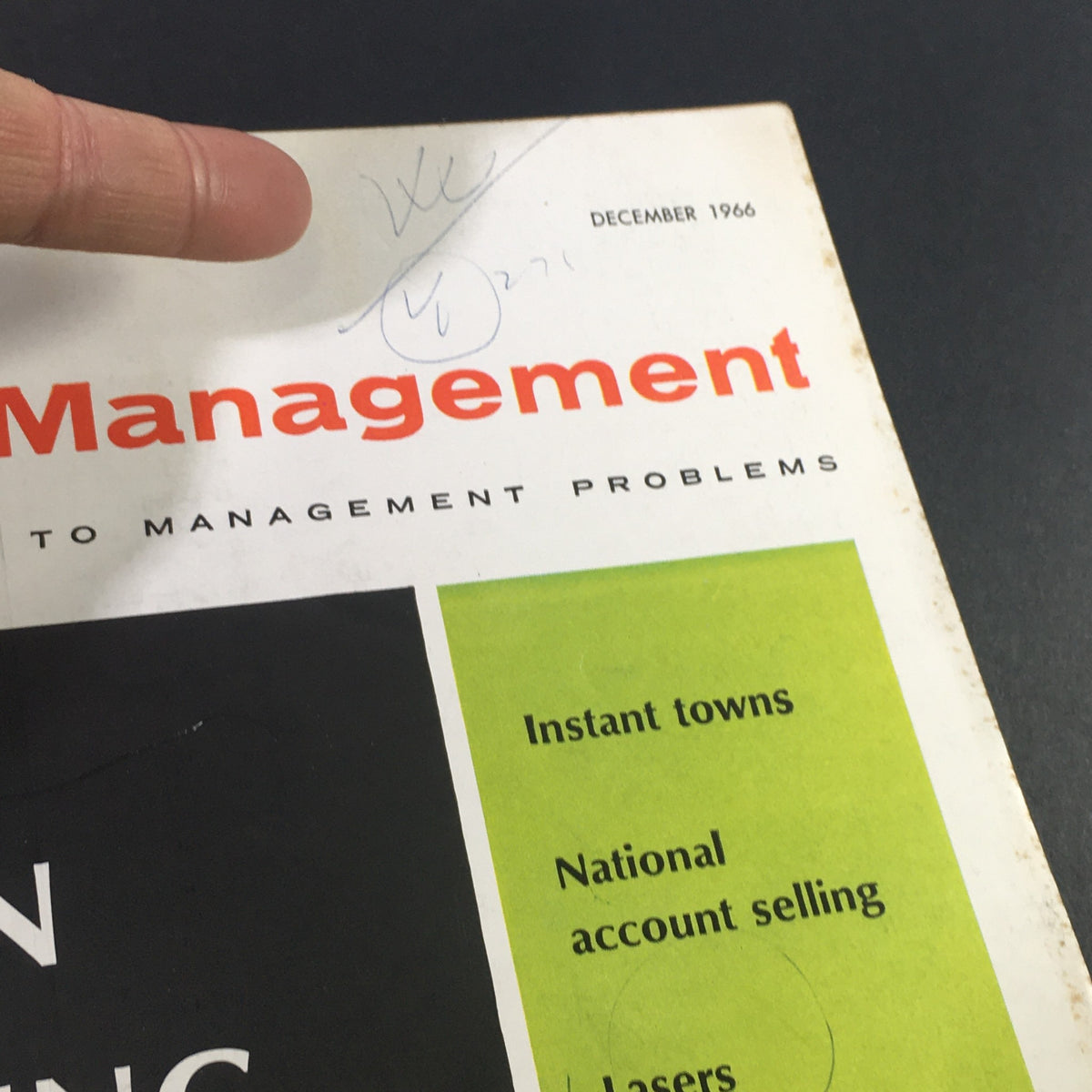 Close-up detail of the cover page of VTG Business Management Magazine December 1966, highlighting the title 'Seven Emerging Ideas' along with featured topics such as Coordinated bargaining, Selective dissemination of information, and Microwaves. A historic piece for business enthusiasts.
