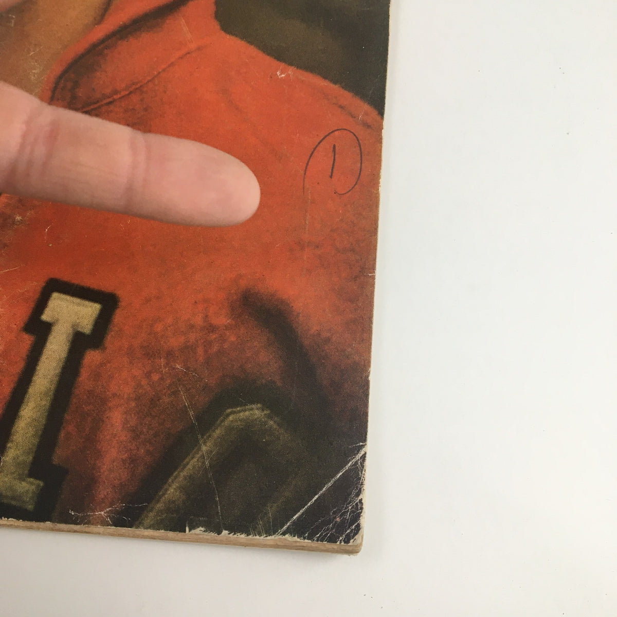 Detailed view of the Sports Illustrated Magazine April 2, 1956 cover showing minor wear and the title along with Al Wiggins' image.