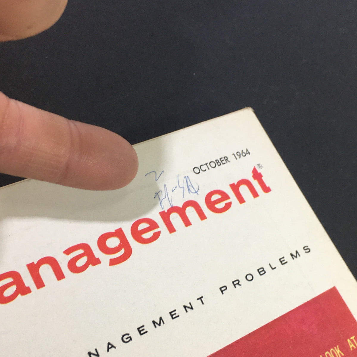 Close-up of the October 1964 issue of Business Management Magazine, highlighting the title and date, featuring a handwritten note on the cover.
