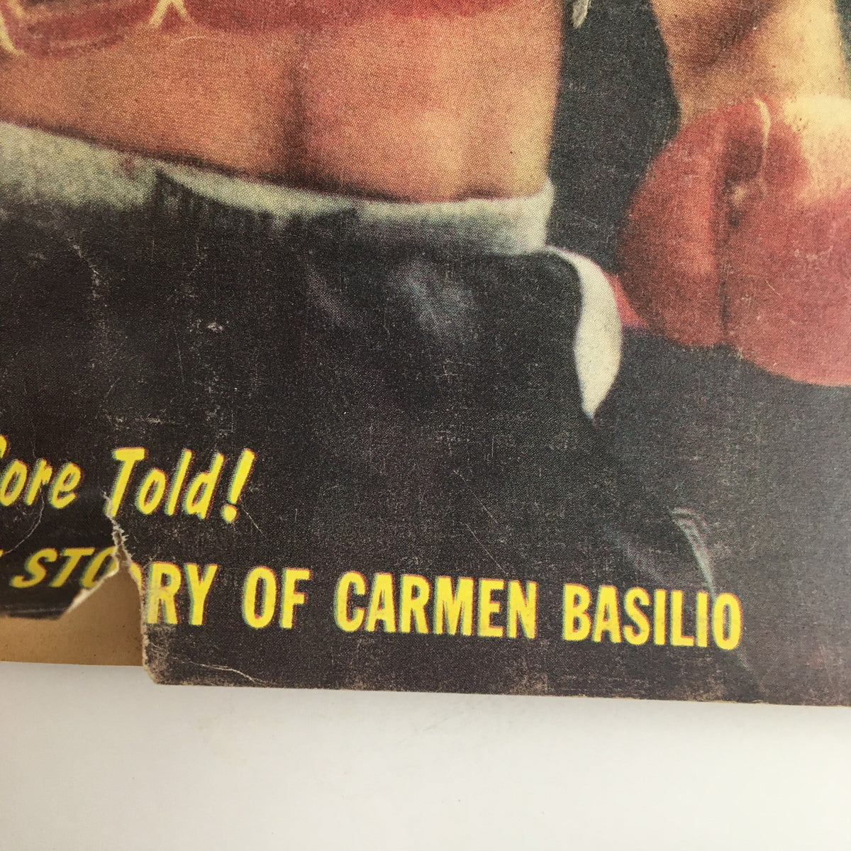 Close-up of the cover text on the TRUE The Man's Magazine Boxing Yearbook 1959, emphasizing 'The Inside Story of Carmen Basilio' with visible wear and details of the magazine.