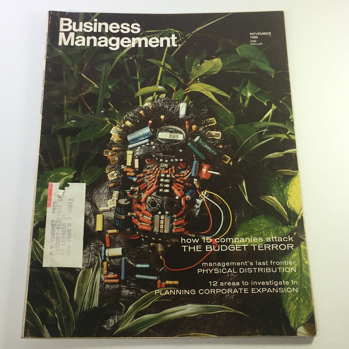 VTG Business Management Magazine November 1969 cover featuring a unique artistic design related to budget management. Includes the title 'The Budget Terror' and highlights on corporate expansion and distribution.