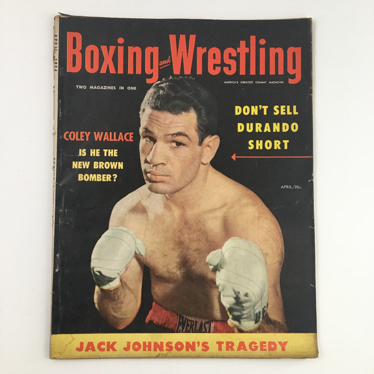 Boxing and Wrestling Magazine April 1954 cover featuring Colley Wallace, showcasing combat sports history and iconic headlines.