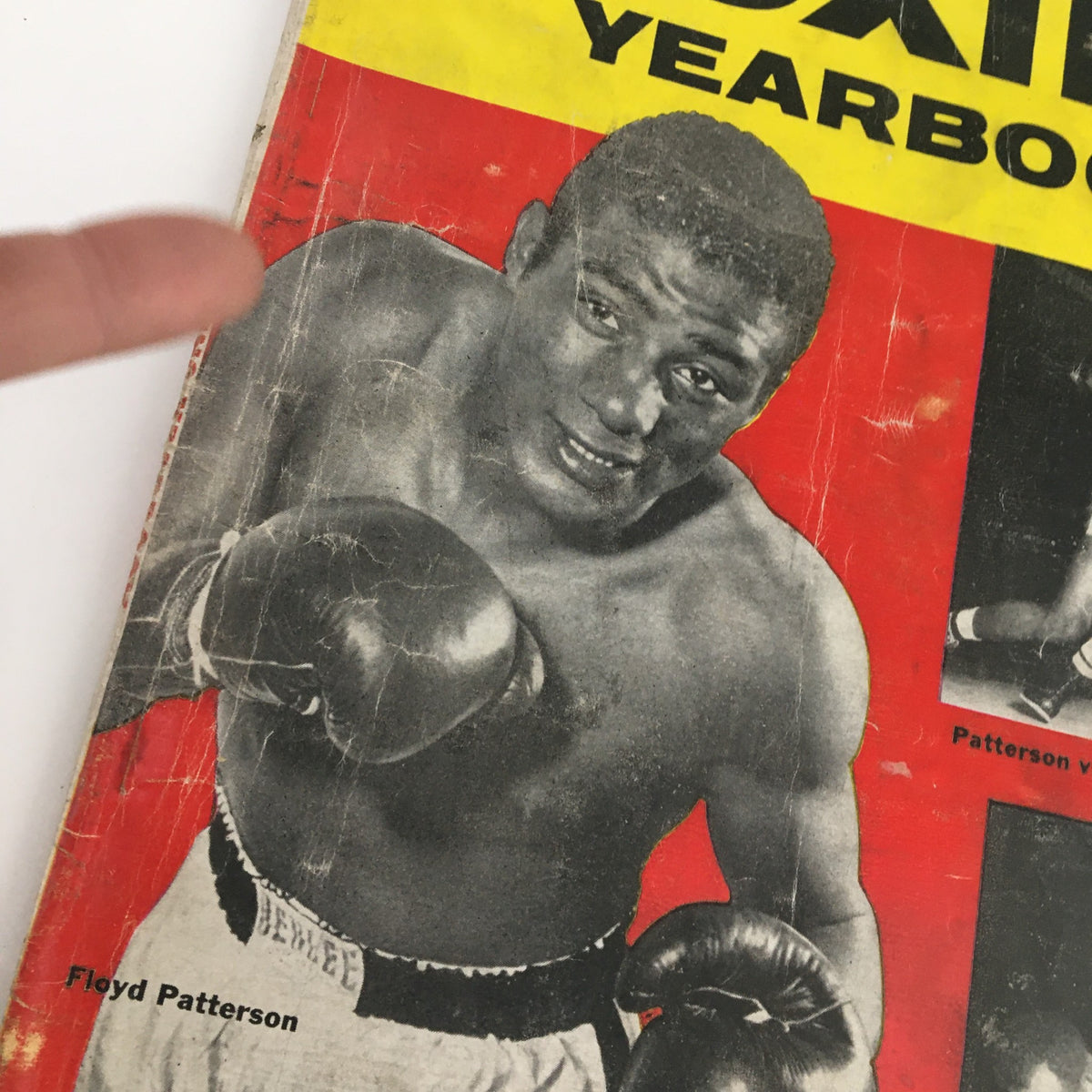Close-up of the True Magazine Boxing Yearbook 1957 cover emphasizing Floyd Patterson, illustrating his readiness for boxing, with text about notable fights and boxers inside.
