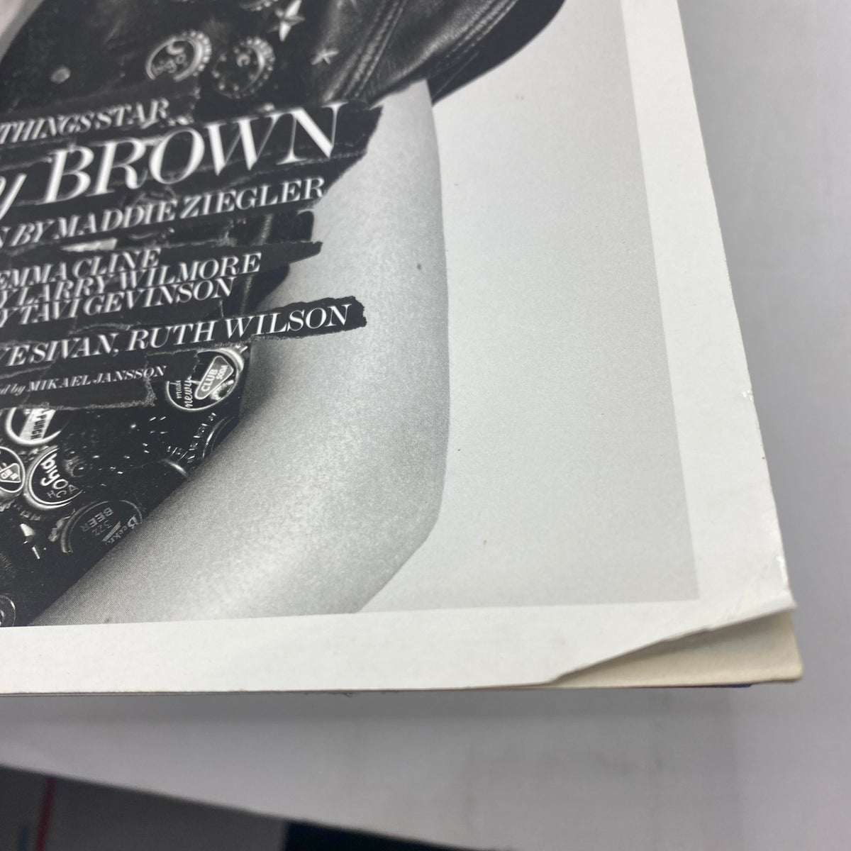 Close-up of the corner of Interview Magazine November 2016 with Millie Bobby Brown's name prominently featured, showcasing vintage magazine detail and a stylish cover.