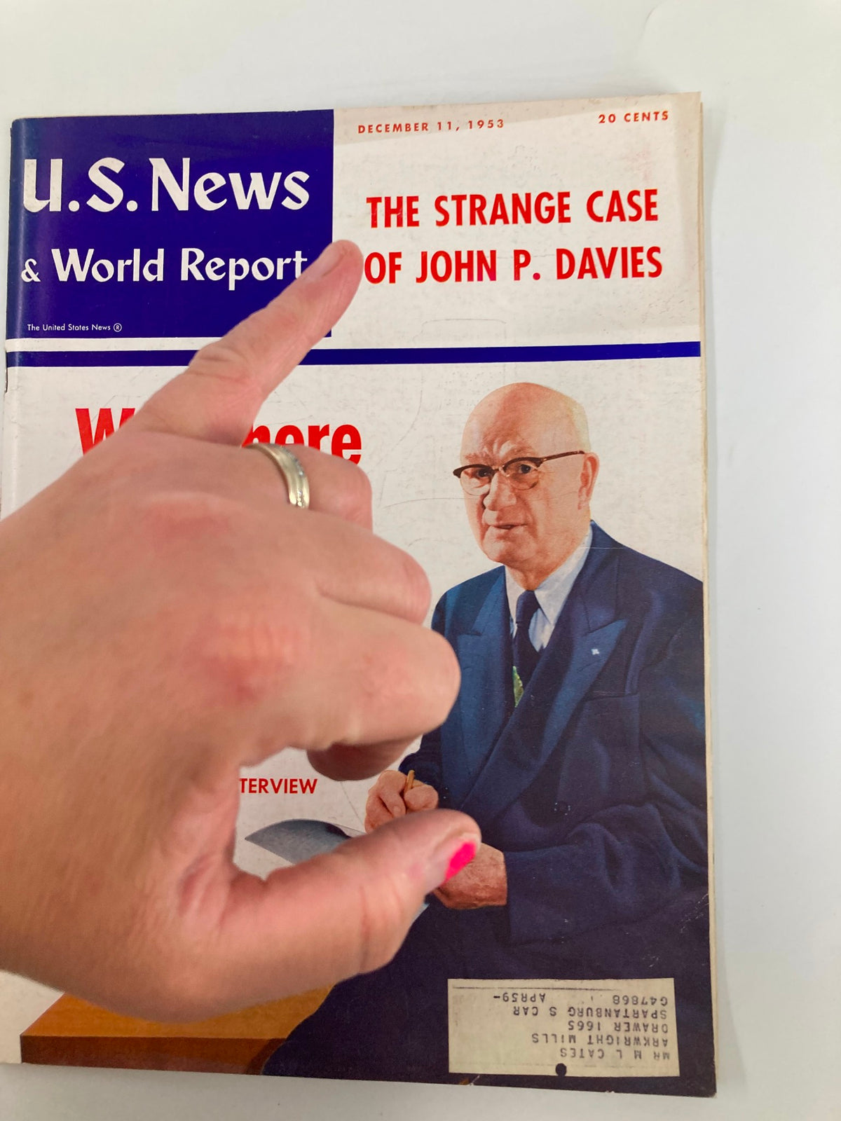 US News & World Report Magazine December 11, 1953 cover showcasing the title 'The Strange Case of John P. Davies' with a hand pointing at the article headline, emphasizing the content and historical significance of the magazine.