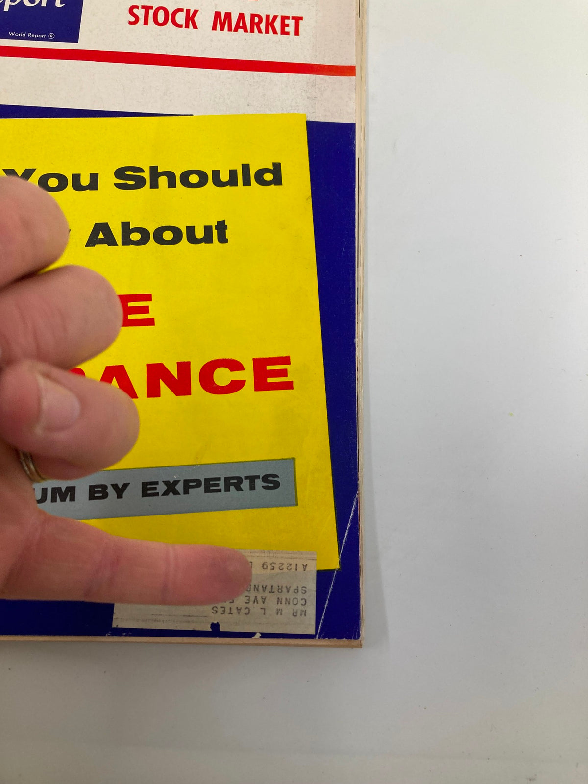 Close-up view of the cover of US News & World Report Magazine, June 8, 1956, highlighting the life insurance symposium and additional details on the magazine's front.