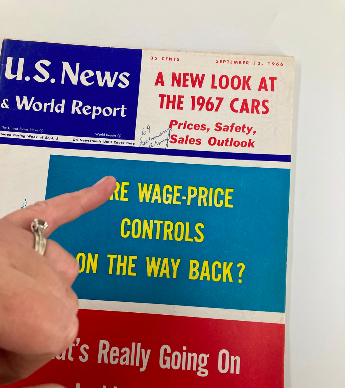 Close-up of the cover of US News & World Report Magazine September 12, 1966, highlighting the title 'A New Look at The 1967 Cars' along with an inquiry about wage-price controls.