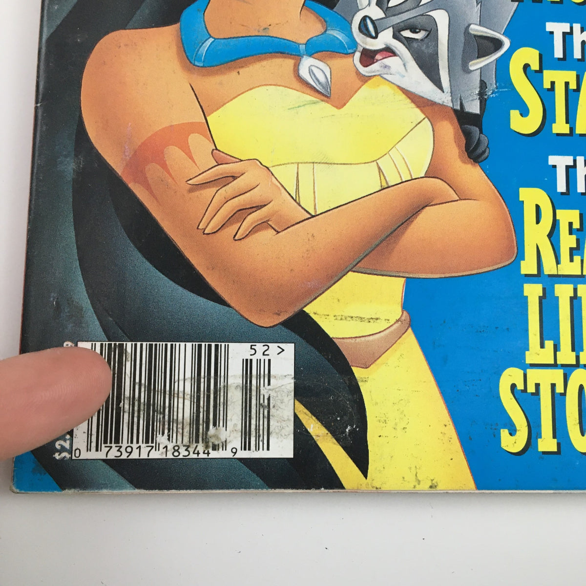 Close-up of the Disney Adventures Magazine cover from July 31, 1995, showing the barcode and details alongside Pocahontas and her raccoon friend.