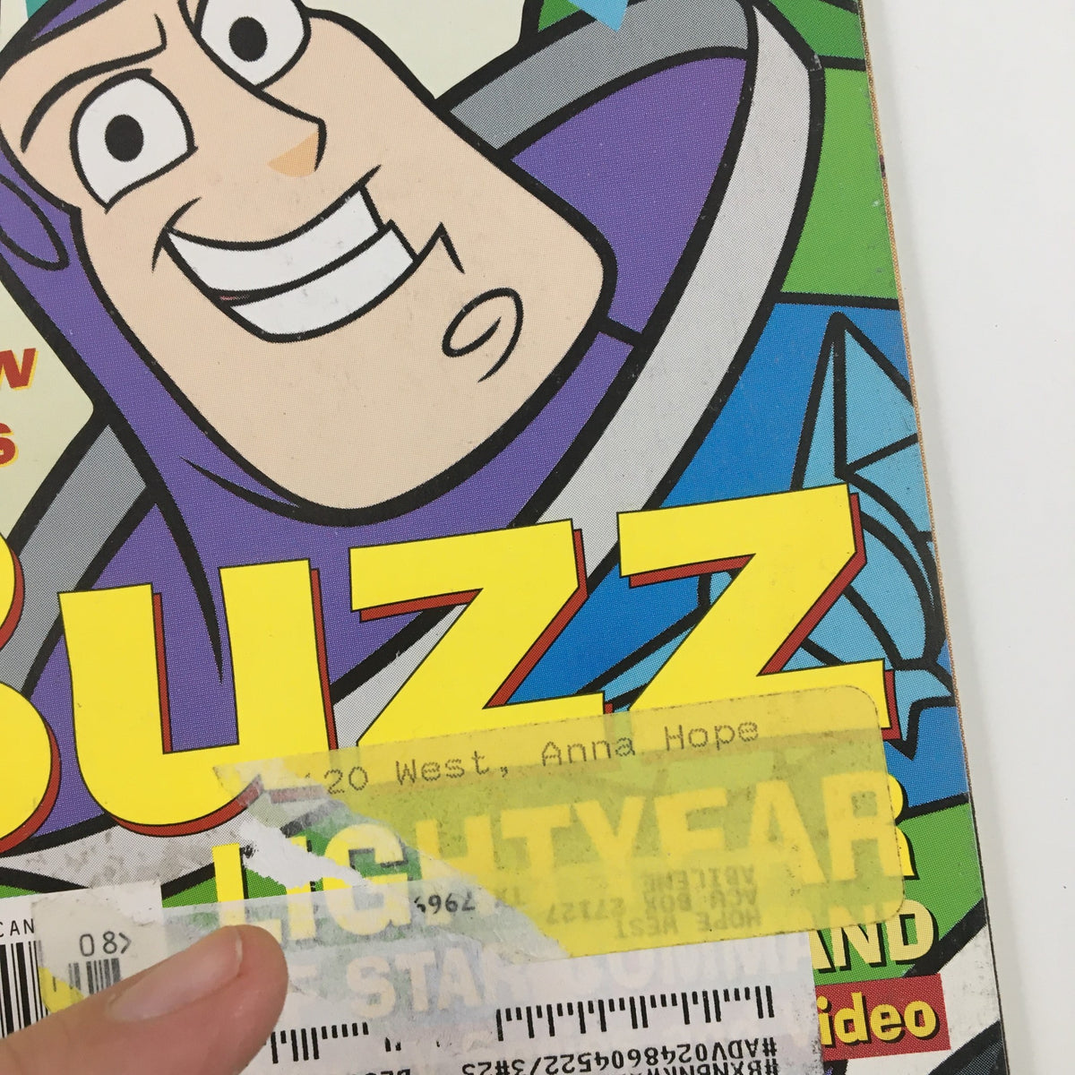 Close-up of Disney Adventures Magazine August 2000 cover, highlighting Buzz Lightyear and an address label for authenticity.