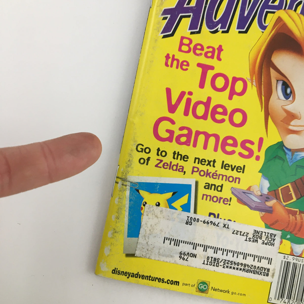 Disney Adventures Magazine May 1999 cover featuring Zelda and Pokémon, promoting tips to Beat the Top Video Games. The cover highlights iconic characters and vibrant colors, showcasing nostalgia for classic gaming.