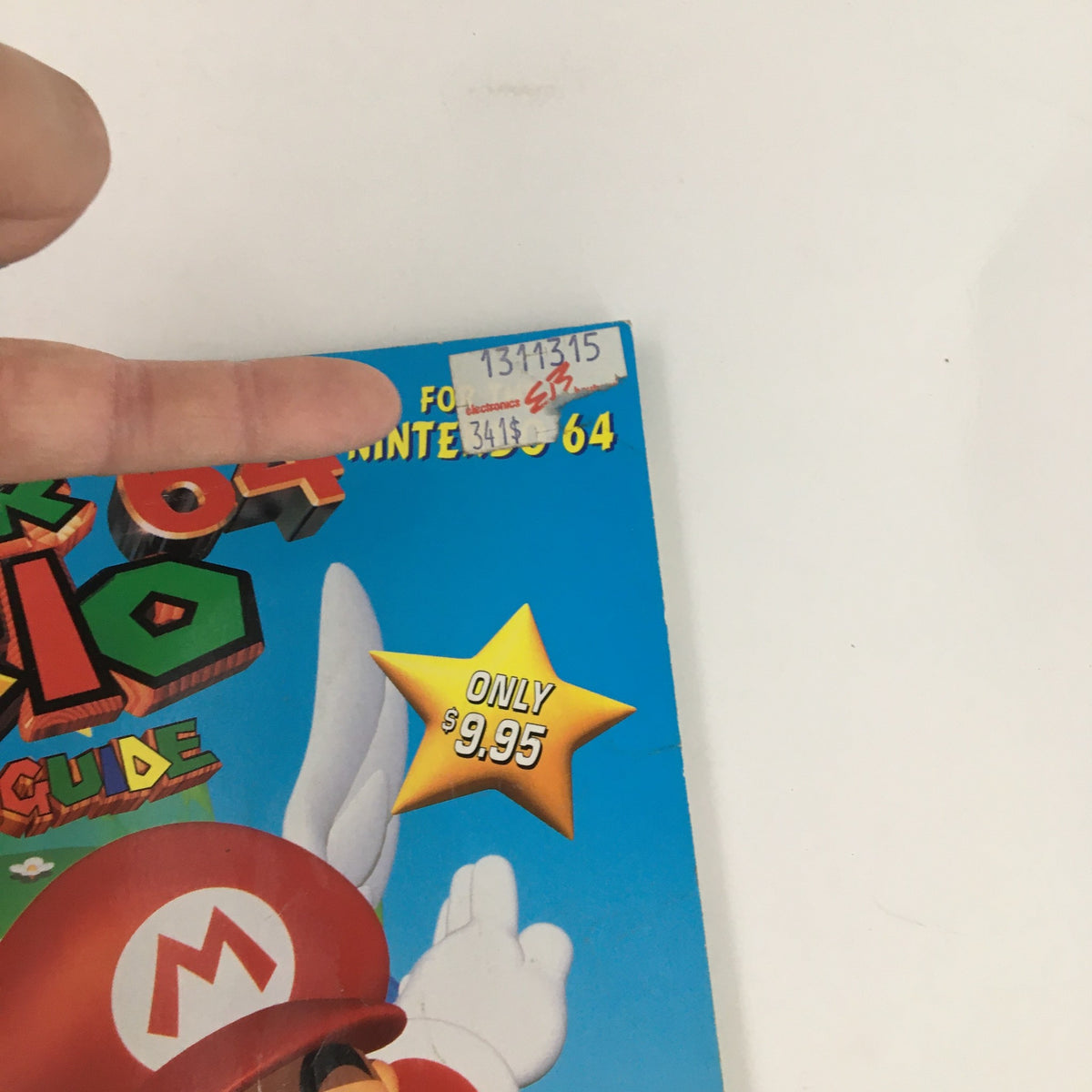 GameFan Books Super Mario 64 Strategy Guide No Label front cover featuring Mario and a price tag, showcasing classic 90s gaming nostalgia.