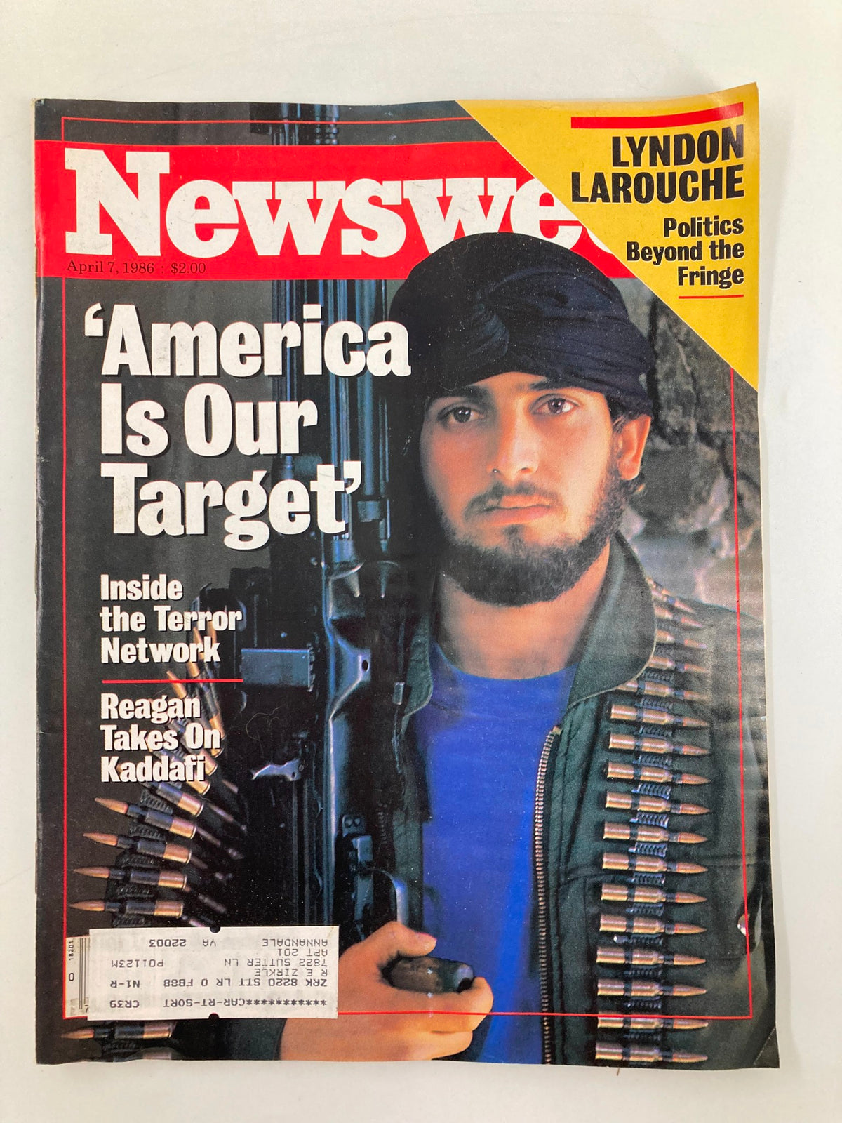 Cover of Newsweek magazine from April 7, 1986, featuring the headline 'America Is Our Target' and a photograph of a man in military attire holding a gun. The magazine also discusses Ronald Reagan's stance on Kaddafi and includes a section on Lyndon Larouche.