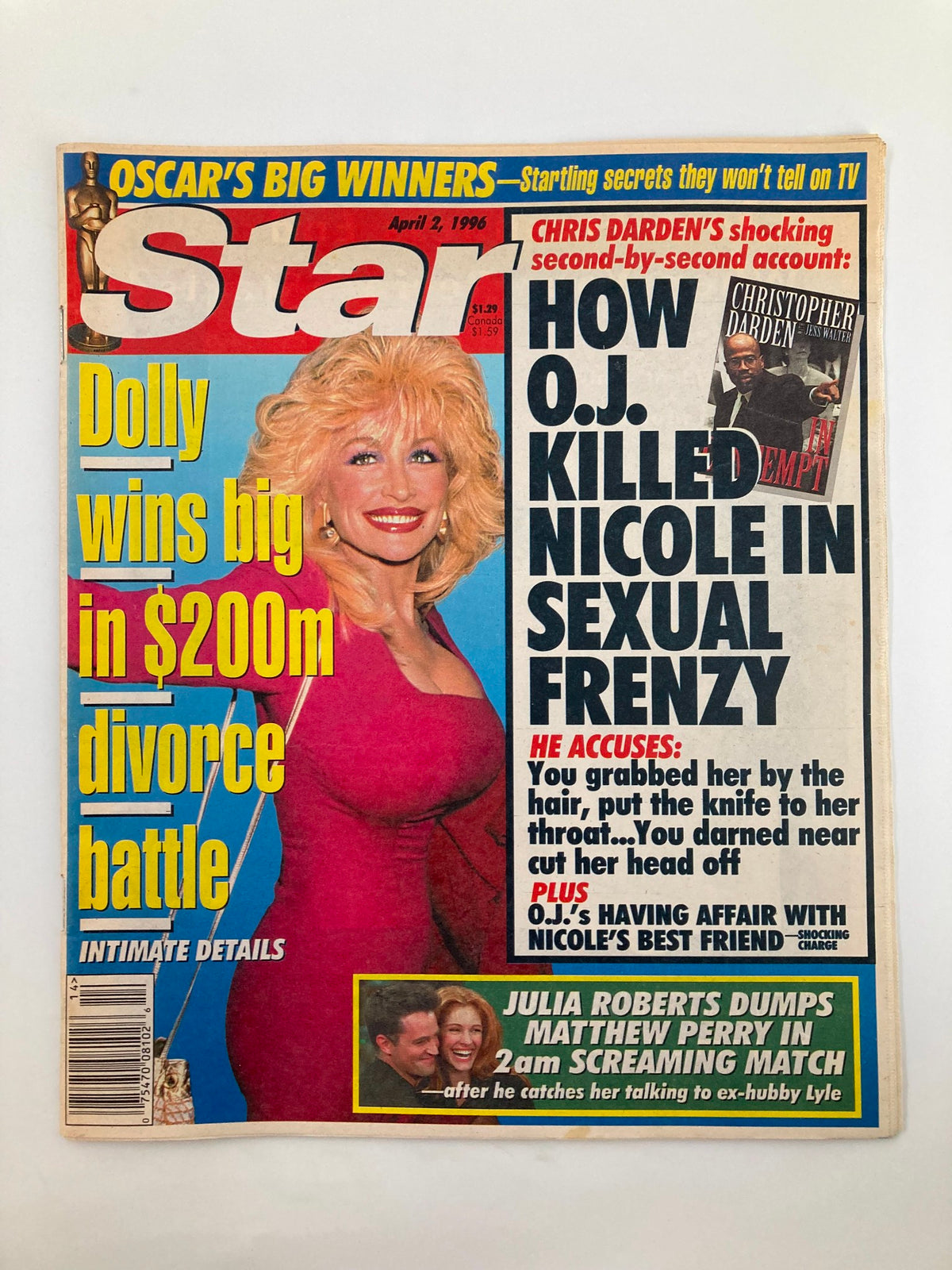 Star Tabloid Magazine from April 2, 1996 featuring Dolly Parton and Julia Roberts on the cover. The magazine highlights Dolly's big win in a $200 million divorce battle while revealing shocking details about the O.J. Simpson case, alongside a story about Julia Roberts' romantic relationship with Matthew Perry. A vintage collectible representing 1990s celebrity culture.