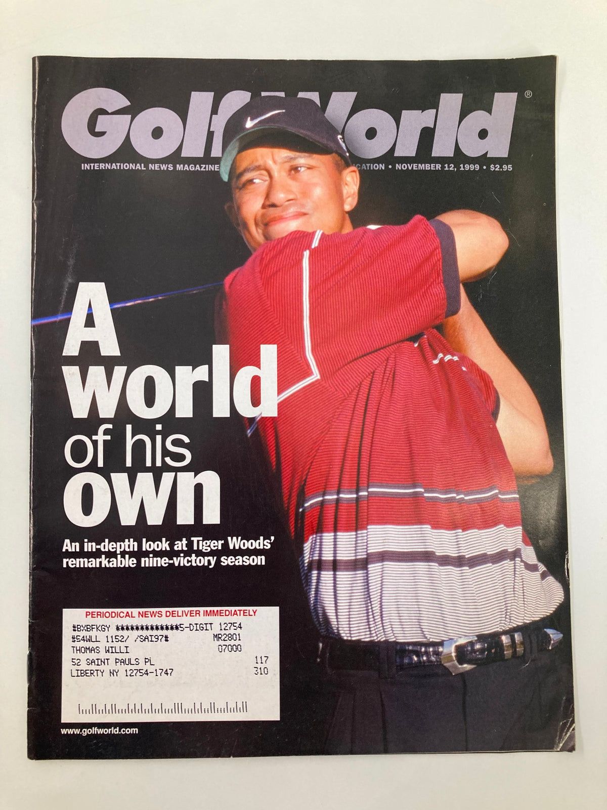 Cover of Golf World Magazine dated November 12, 1999, Volume 53 Issue 21 featuring Tiger Woods with the headline 'A World of His Own' and an article about his remarkable nine-victory season.