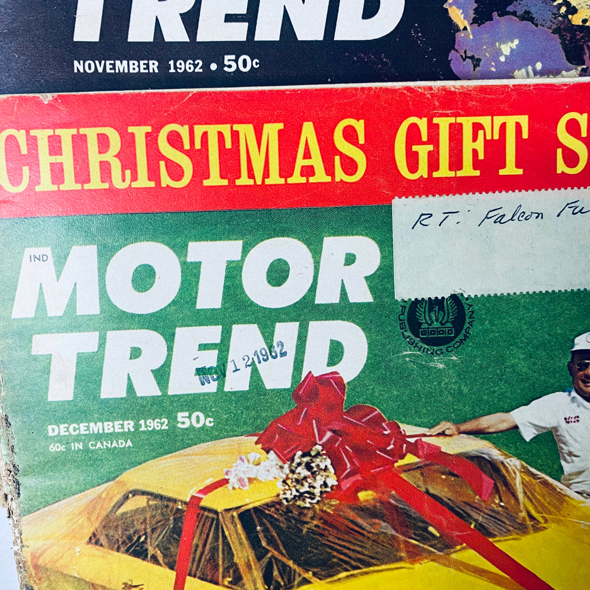 Lot of 11 Motor Trend Magazine covers from 1962, including the November issue with a Christmas gift theme, showcasing a Ford and celebrating automotive highlights.