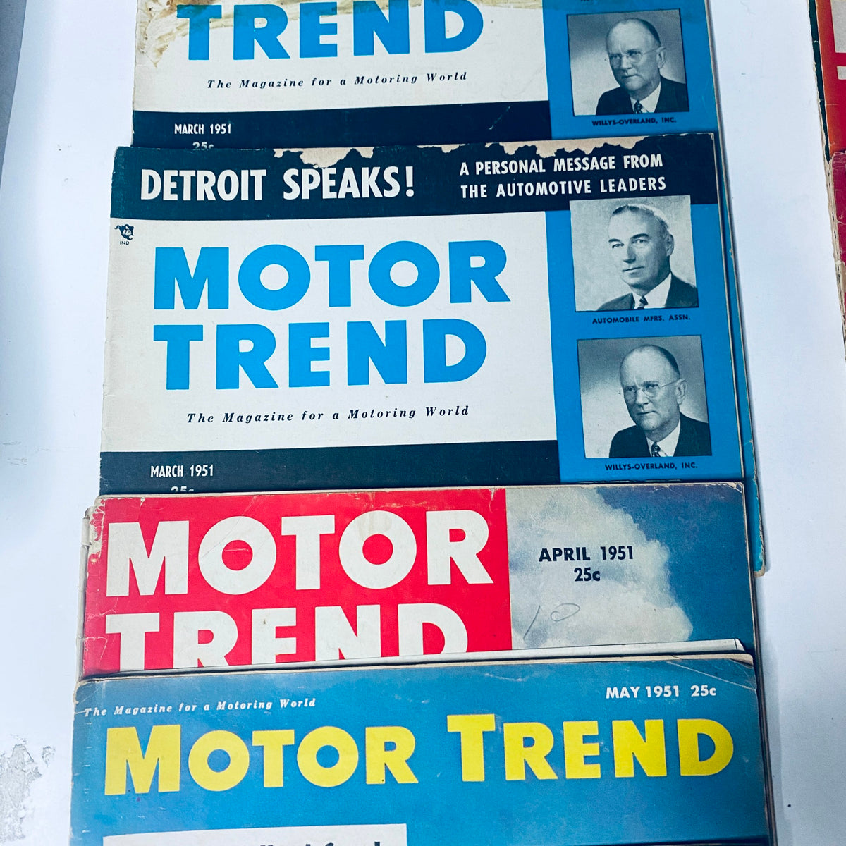 Detailed display of Motor Trend magazines from March and April 1951, including the issue dated March 1951 with automotive industry insights and features.
