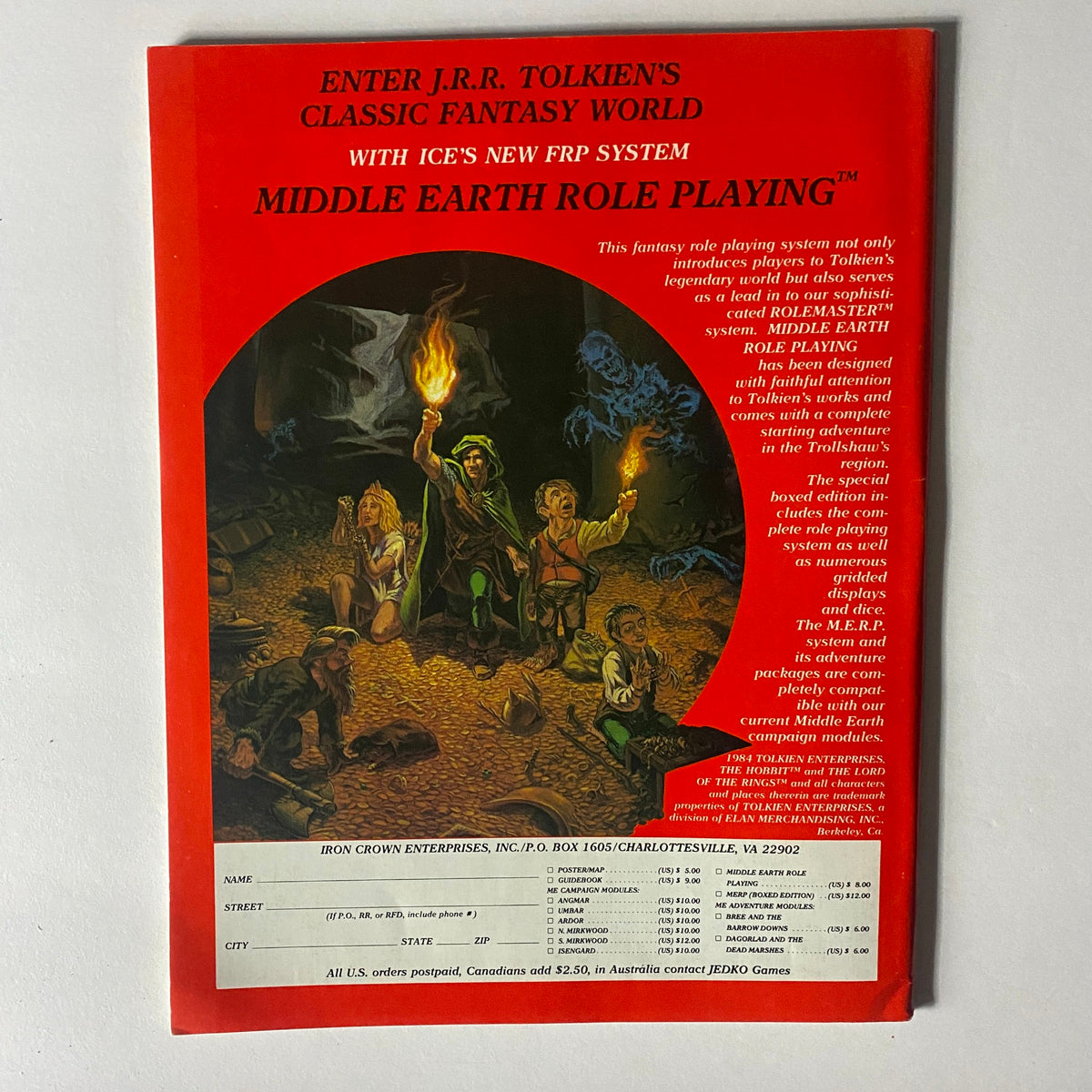 Back cover of VTG Dragon Magazine May 1984 #85 advertising the Middle Earth Role Playing system with an illustration of adventurers in a fantasy setting.