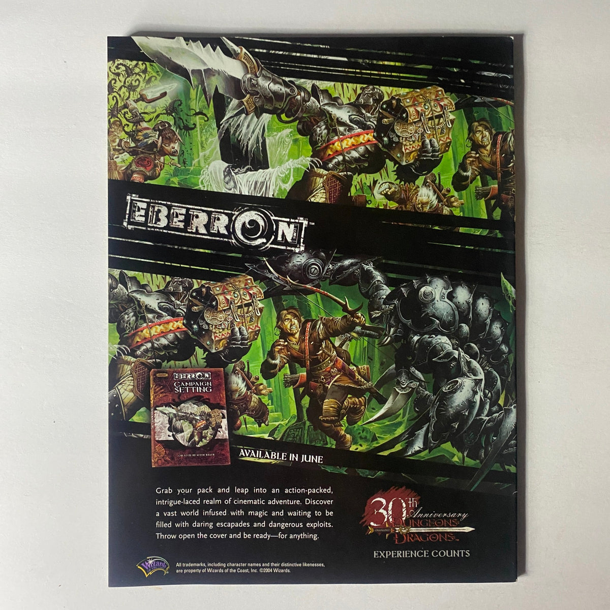 Promotional advertisement for Eberron featured in Dragon Magazine July 2004 #321, highlighting action-packed fantasy content and new game releases for Dungeons & Dragons.