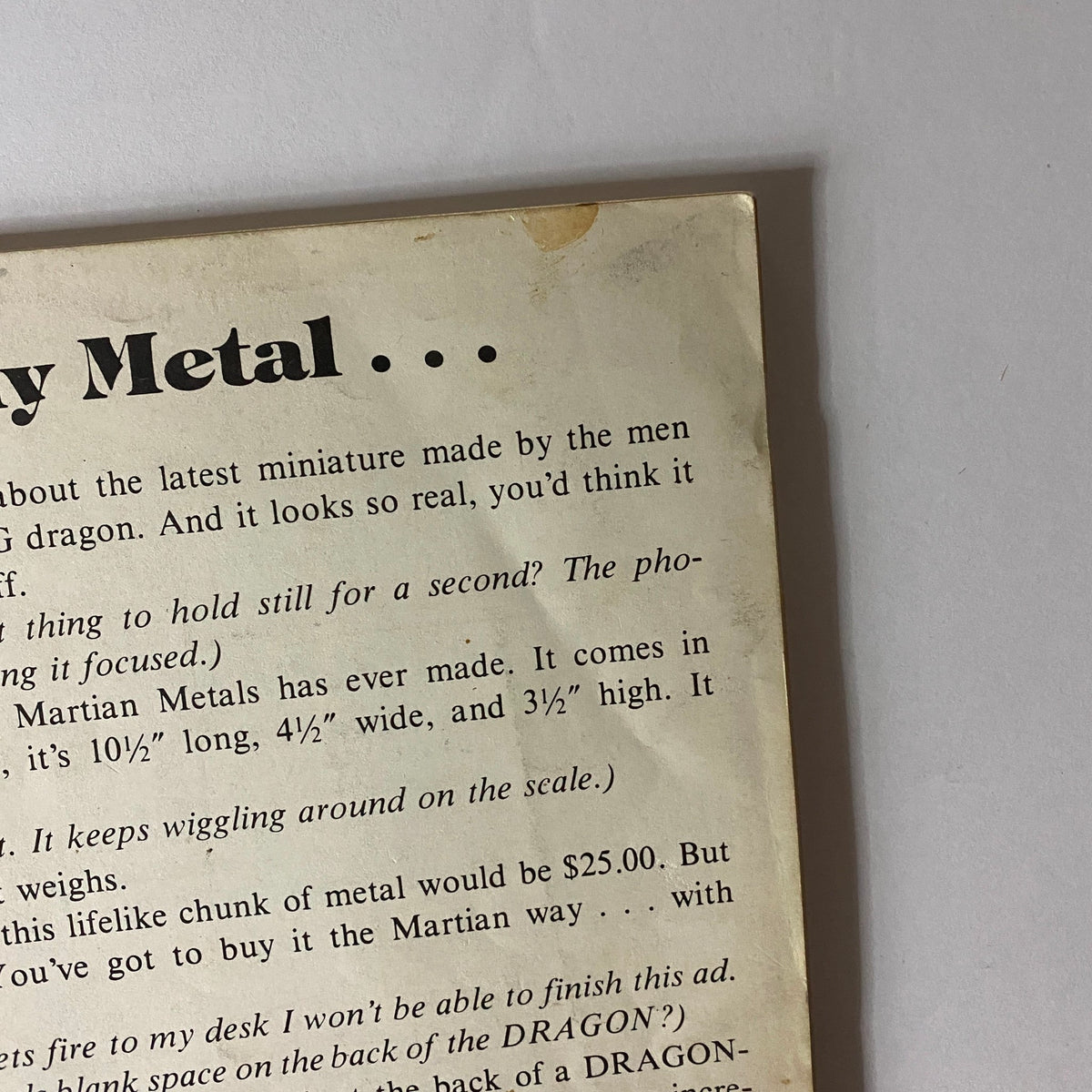 Close-up view of the back cover text from VTG Dragon Magazine August 1980 #40, featuring detailed description of a dragon miniature by Martian Metals.