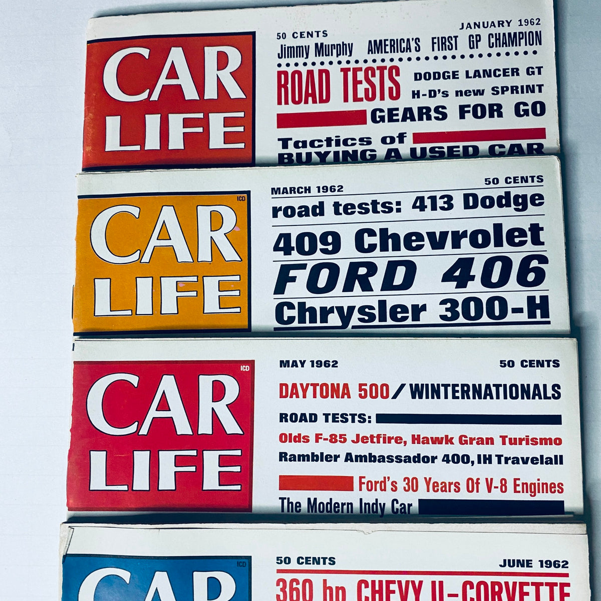 Lot of 8 Car Life Magazines, featuring covers from March, May, and June 1962, presenting classic car road tests and automotive insights.