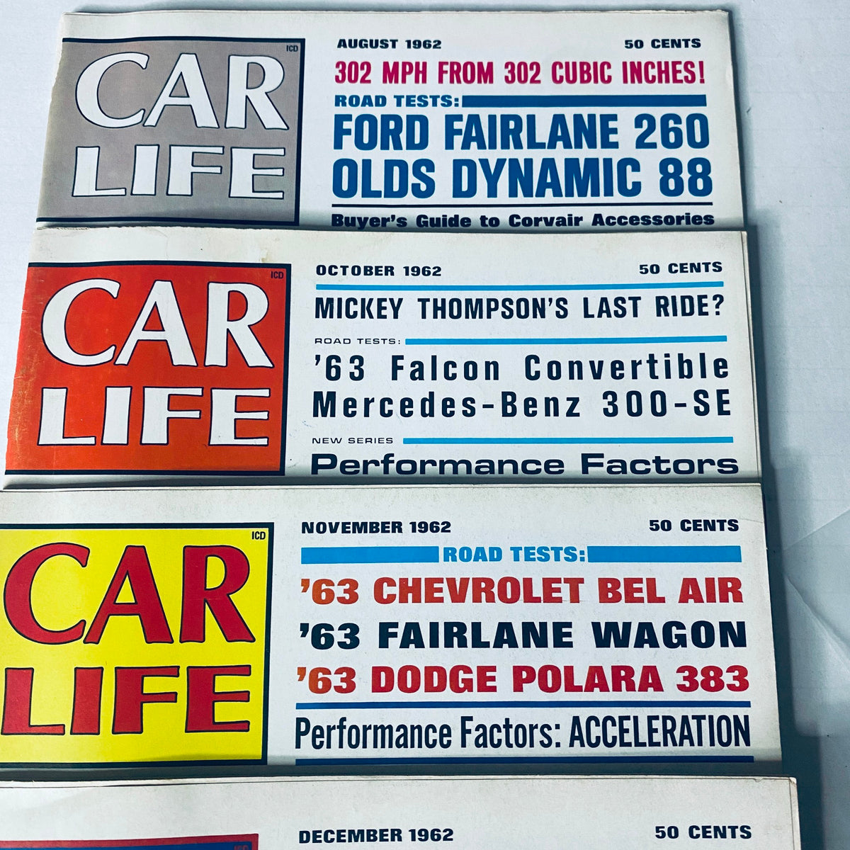 Lot of 8 Car Life Magazines, displaying October and November 1962 covers, focusing on classic cars, performance factors, and automotive reviews.