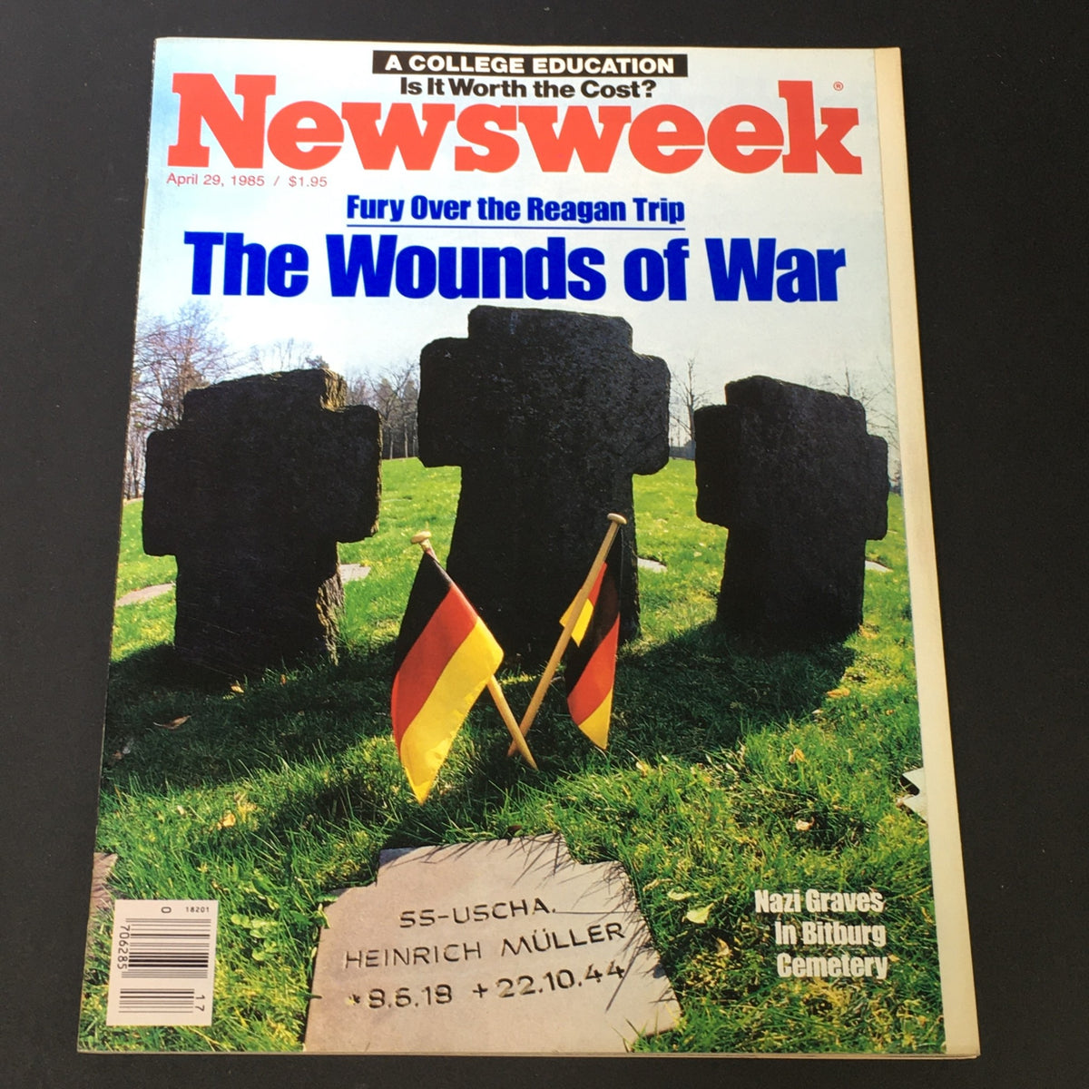 VTG Newsweek Magazine Cover from April 29, 1985 featuring a poignant image of graves and flags, titled 'The Wounds of War', discussing Ronald Reagan's trip.