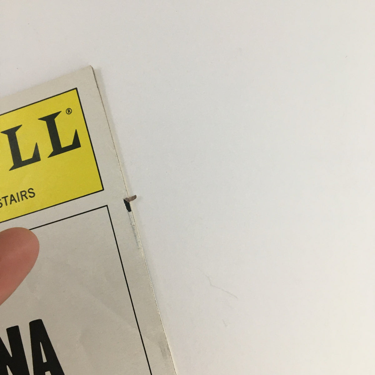 Detail shot of the 2001 Playbill for The Vagina Monologues highlighting the edge of the cover.