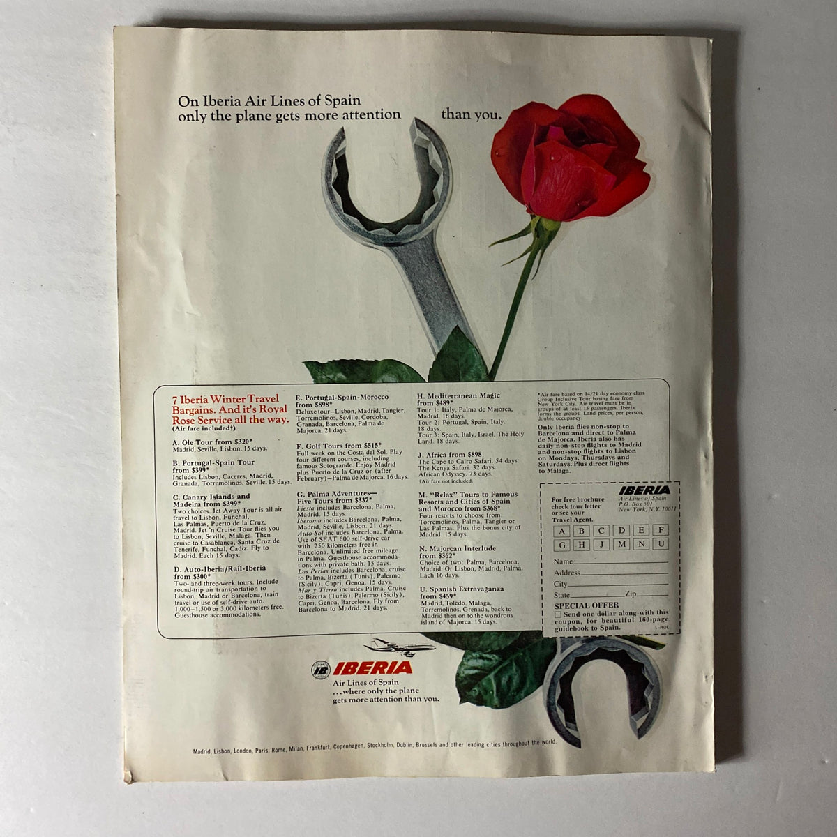 Ad page from the VTG Holiday Magazine January 1969 showcasing travel offers by Iberia Air Lines of Spain with an artistic image of a wrench and a rose.