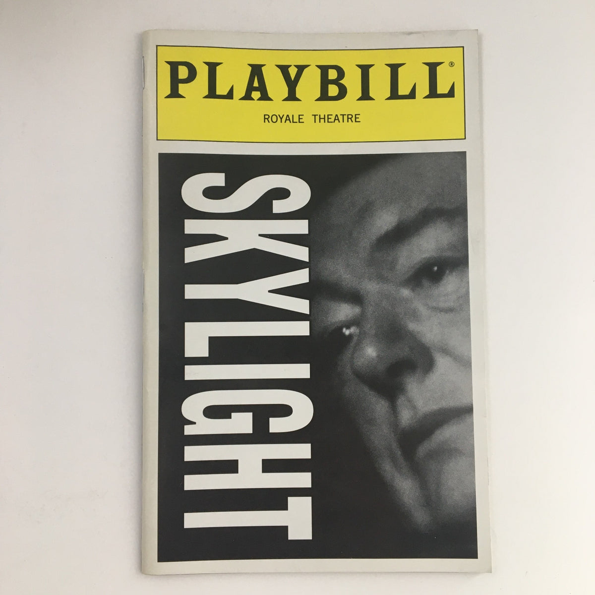 1996 Playbill for Skylight featuring a close-up image of a male actor, produced by Royale Theatre and directed by Richard Eyre.