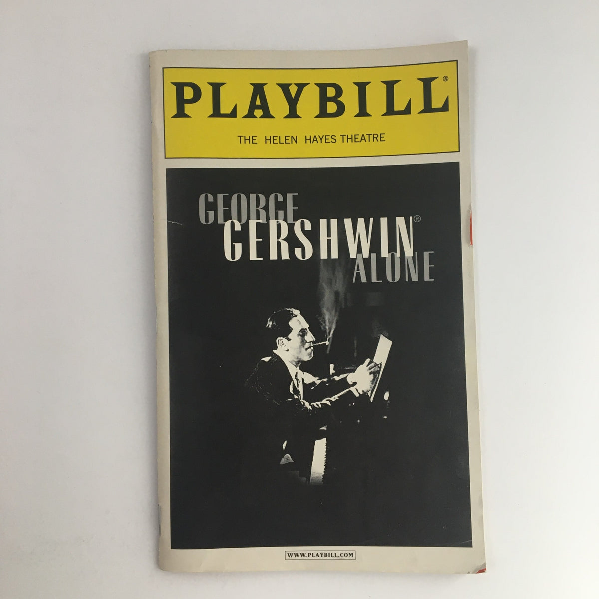 2001 Playbill for George Gershwin Alone at The Helen Hayes Theatre featuring Hershey Felder, showcasing a vintage cover design with a portrait of Gershwin.