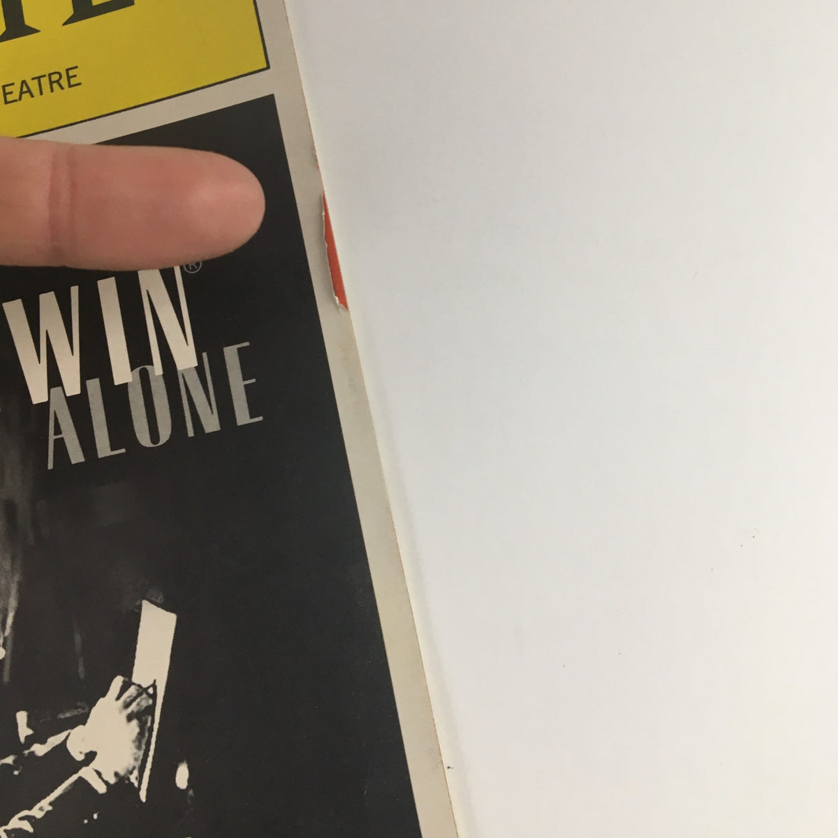 Close-up of the 2001 Playbill from The Helen Hayes Theatre featuring Hershey Felder in George Gershwin Alone, showcasing the cover design with a partially visible finger pointing.