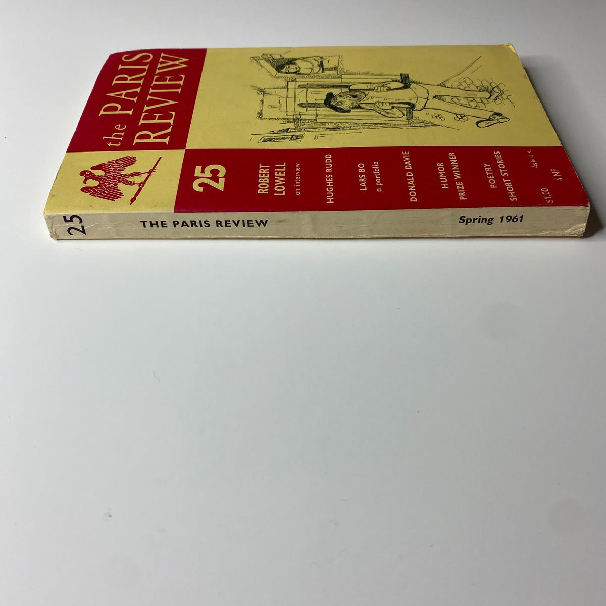 Side view of The Paris Review Magazine Spring 1961, No. 25, showcasing its spine and cover design, emphasizing the magazine's literary features.