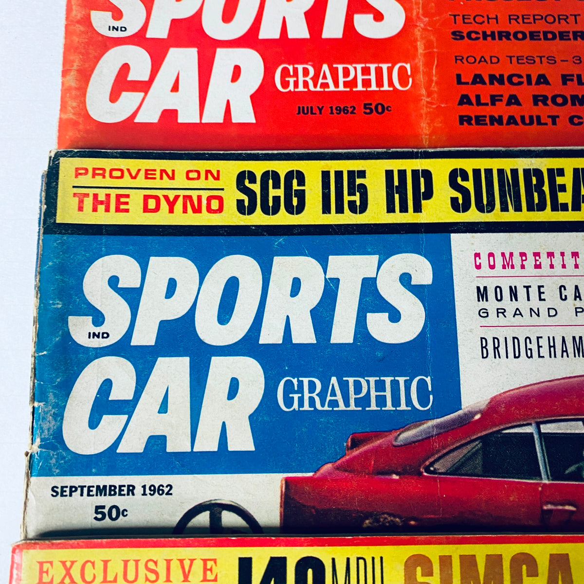 July and September 1962 editions of Sports Car Graphic Magazine featuring SCG H5 Sunbeam Alpine and Lancia Flavia race results.