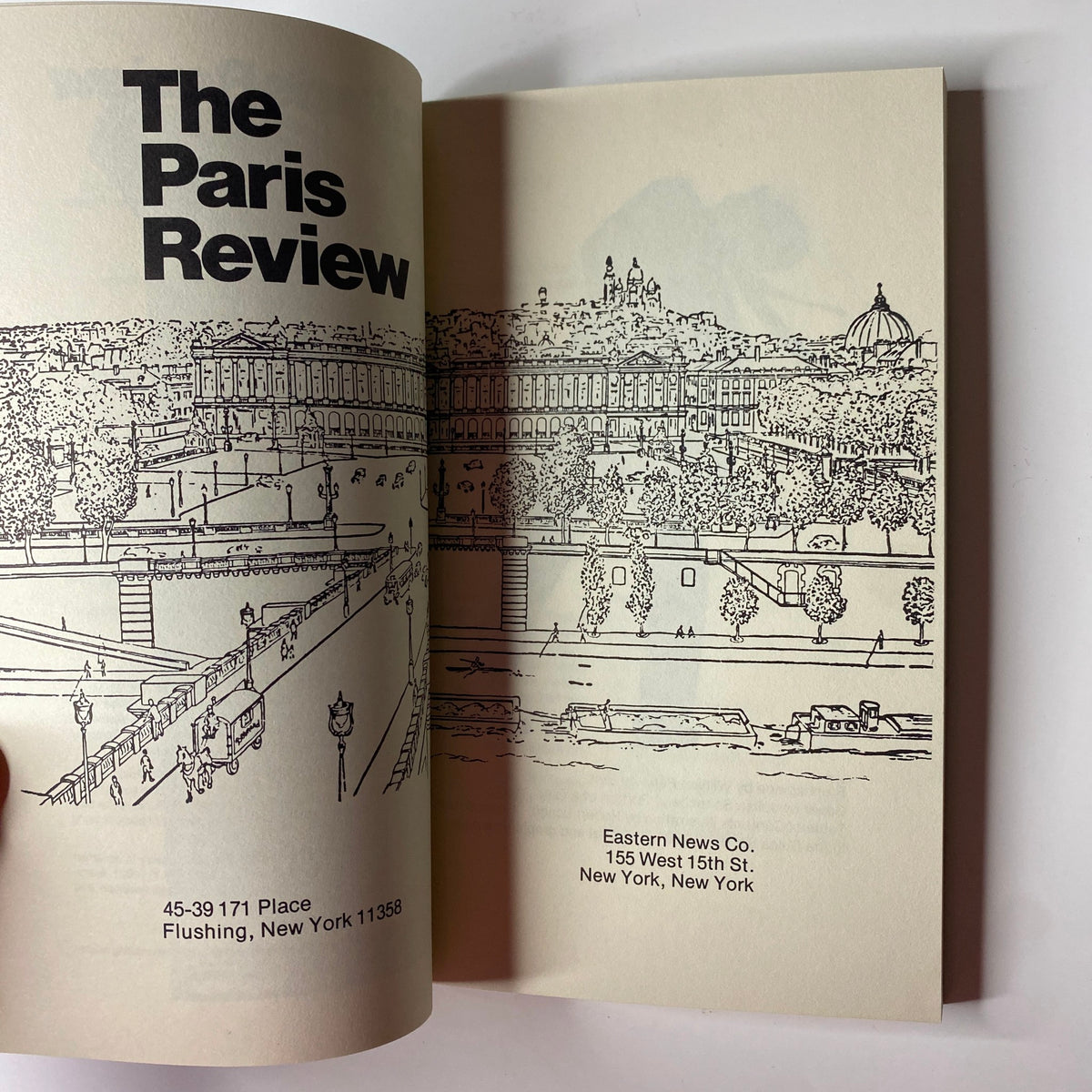 Interior page of The Paris Review magazine showcasing an illustration of the cityscape. The magazine title is prominently featured along with publication details.