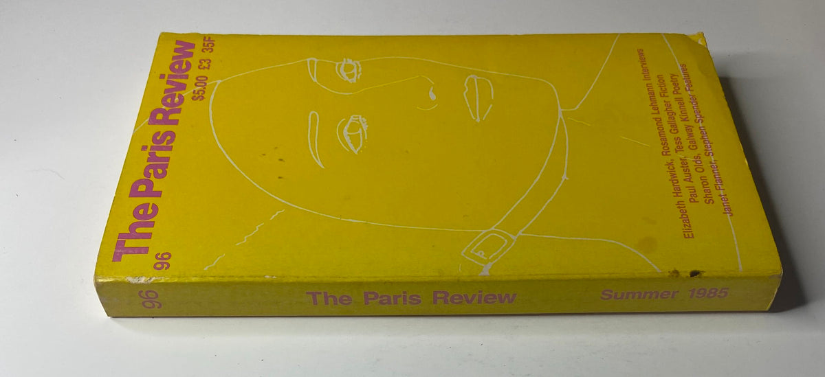 Side view of The Paris Review Magazine Summer 1985 No. 96, highlighting its yellow spine with the issue number and title, showcasing its vintage aesthetic.
