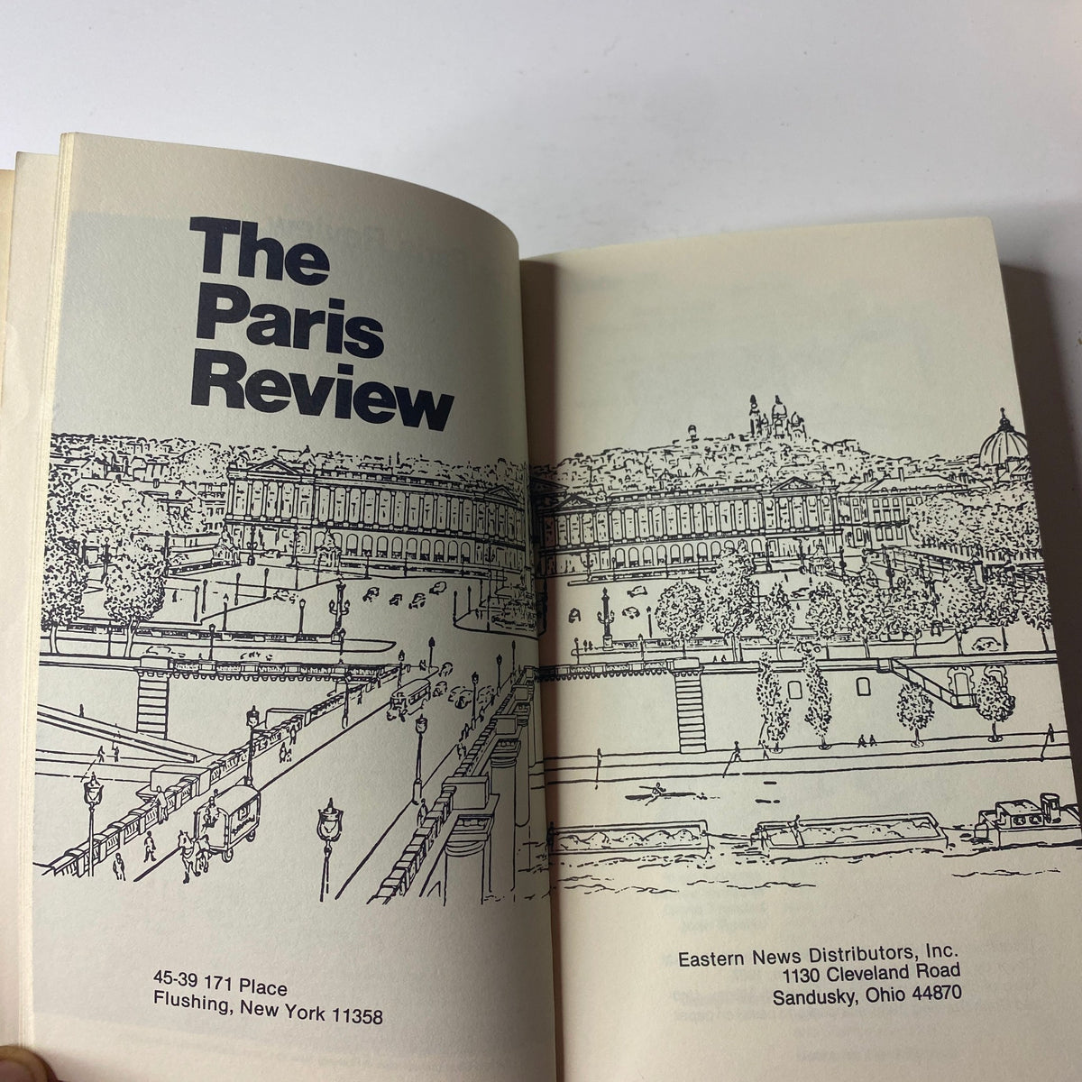 Interior view of The Paris Review Magazine Spring 1988 No. 106, featuring a drawing of a historic building and distribution information for Eastern News Distributors.