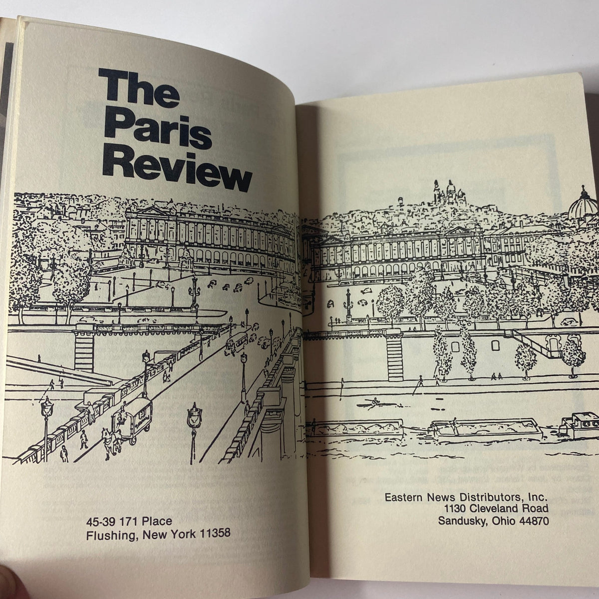 Inside spread of The Paris Review Magazine Winter II 1989 No. 113 displaying the publication's name and an illustration of a scene, emphasizing its literary content.