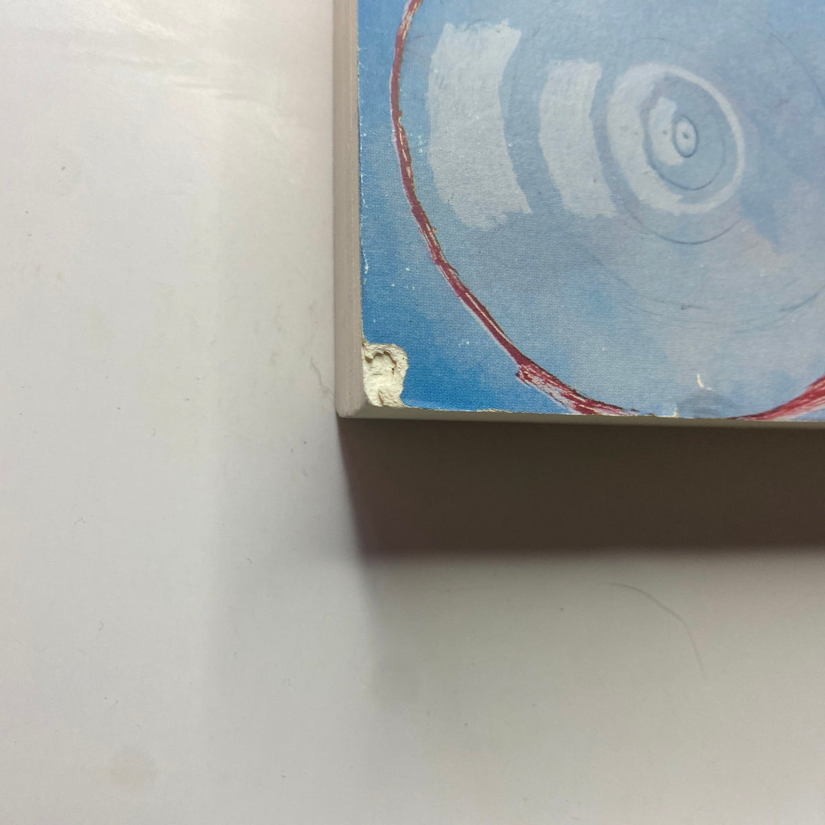 Close-up of the edge detail of The Paris Review Magazine Spring 1994 No. 130 showing minor wear and a chipped corner.