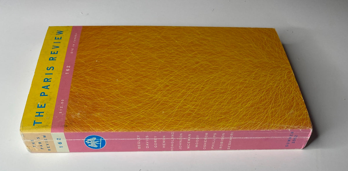 Spine view of The Paris Review Magazine Summer 2002 No. 162 showcasing its title and colorful design.