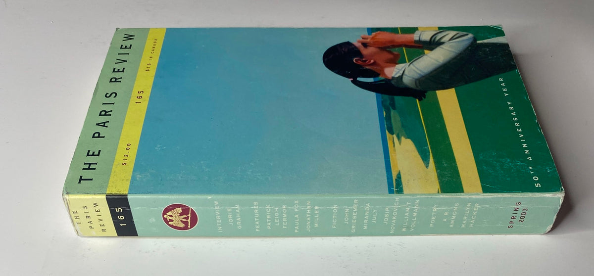 Spine view of The Paris Review Magazine Spring 2003, No. 165, showcasing its title and edition details. The magazine features a vibrant illustration on the cover.