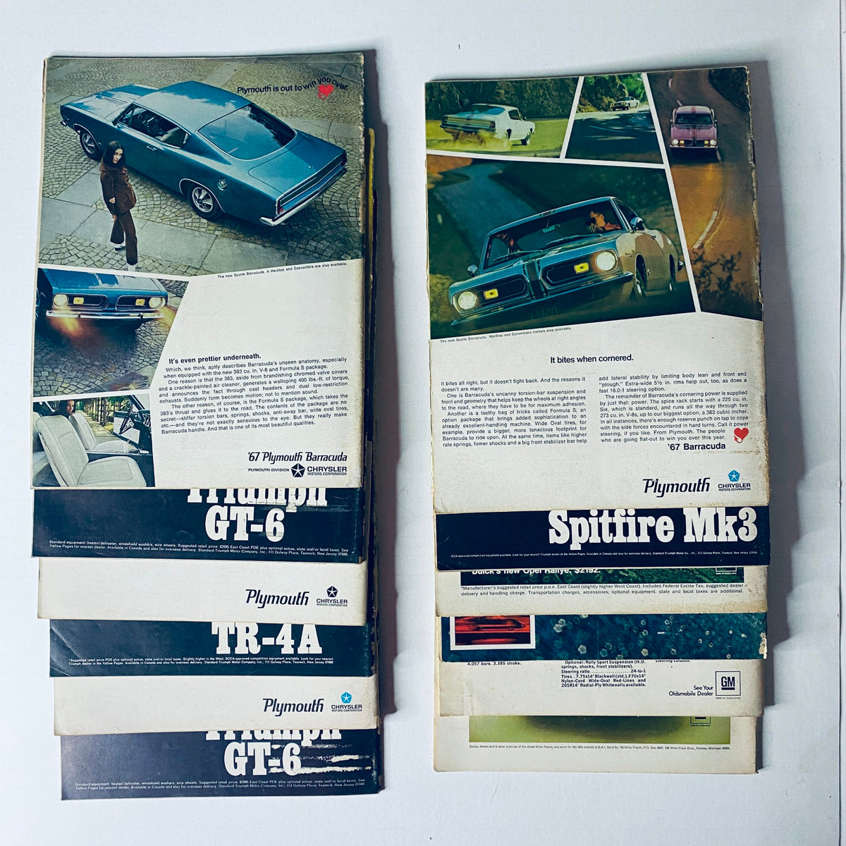Collection of automotive advertisements including a 1967 Plymouth Barracuda and other classic models, presented alongside the Lot of 12 Car and Driver Automotive Magazines from 1967.